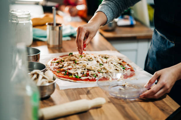 istock making homemade vegetarian pizza 1158748202