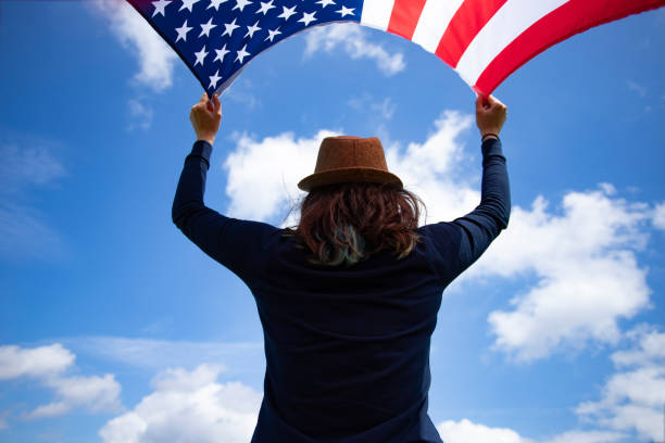 istock Woman with USA flag. 1158748208