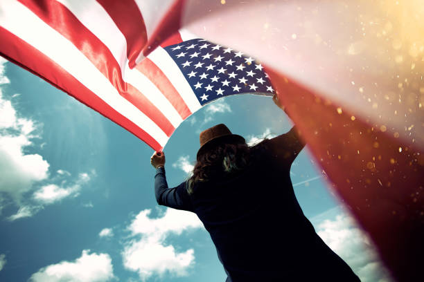 istock Woman with USA flag. 1158748893