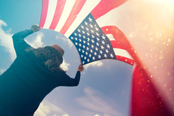 istock Woman with USA flag. 1158748944