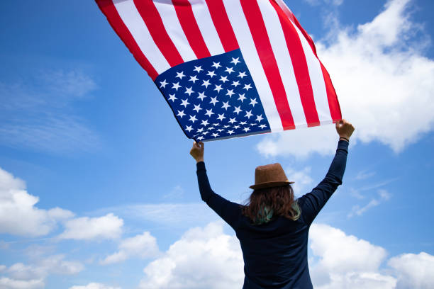 istock Woman with USA flag. 1158749066