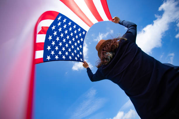 istock Woman with USA flag. 1158749102
