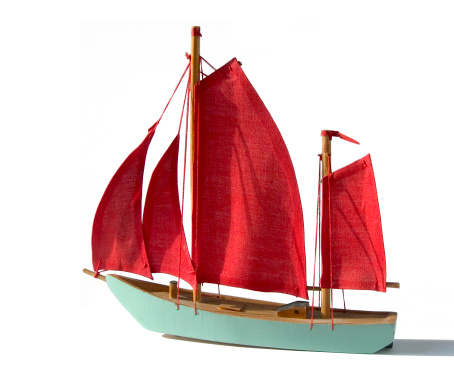 Studio Objects; Turquoise model sailing ship with red sails