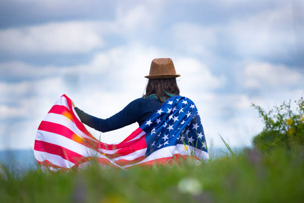 istock Woman with USA flag. 1158749845