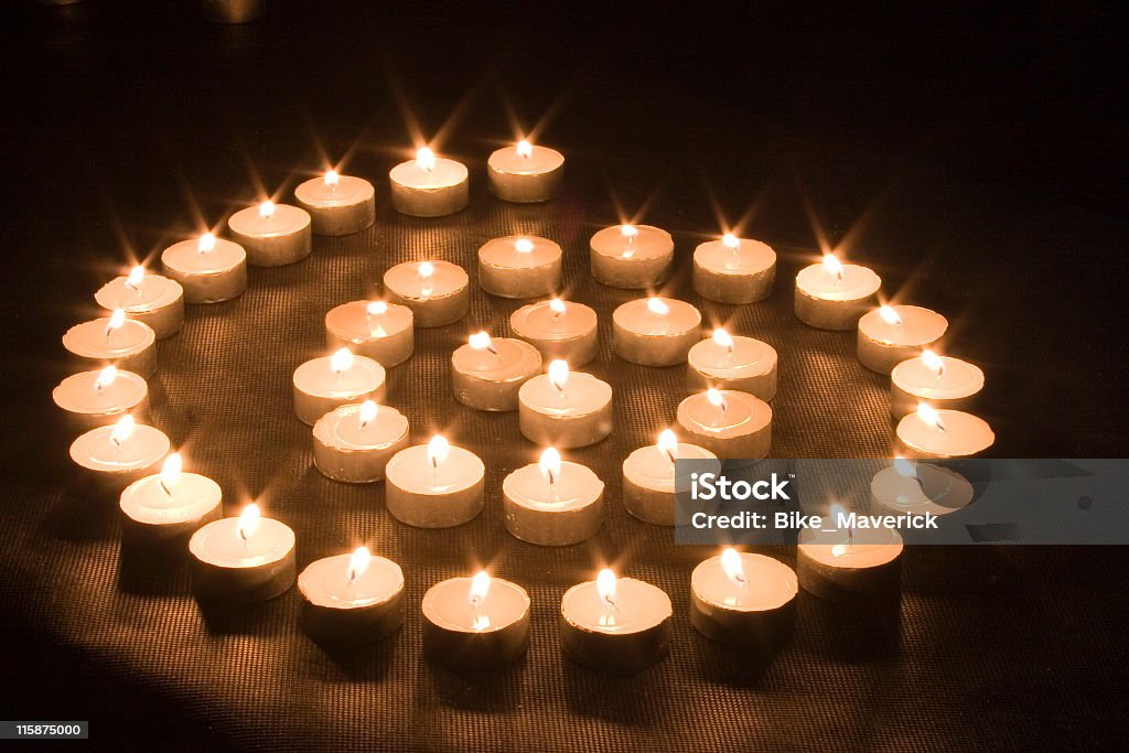 Candle spire Spiral made of candles Black Background Stock Photo