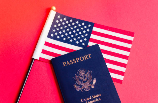 istock American flag and passport. 1158750140