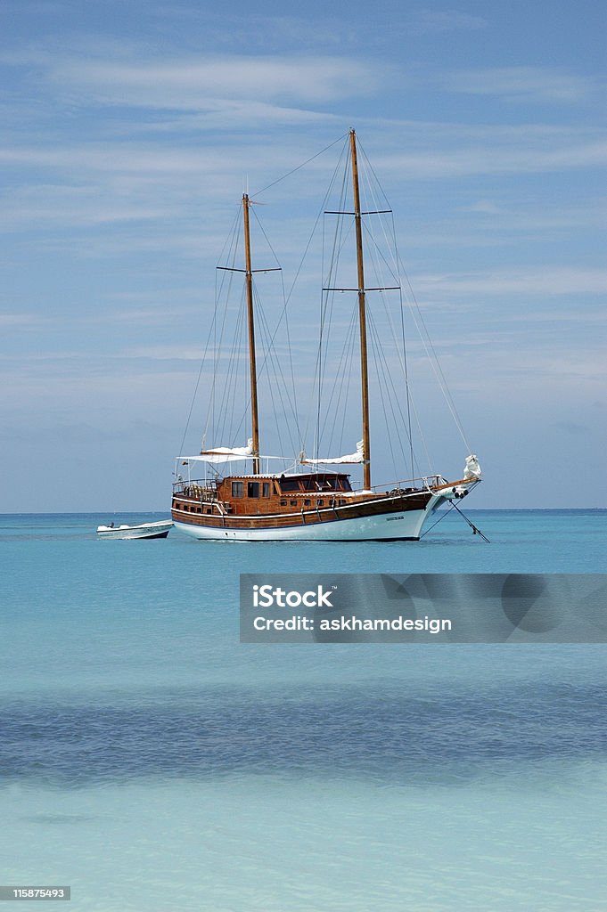 Sail Boat Sail Boat in clear blue water. Blue Stock Photo