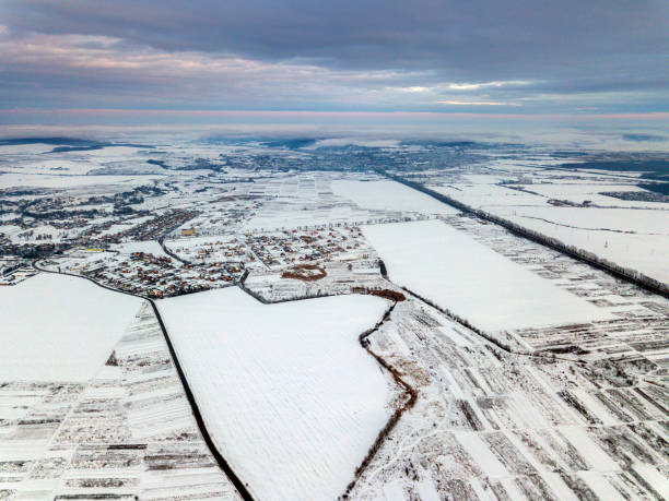 istock Top view of empty snowy fields on winter morning on dramatic cloudy sky background. Aerial drone photography concept. 1158757304