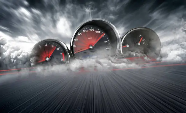 Photo of Speedometer scoring high speed in a fast motion blur racetrack background. Speeding Car Background Photo Concept.