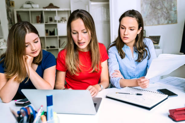 istock Girls studying together on laptop 1158759798