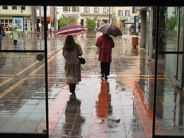 A rainy day at the entrance of a shopping centre.