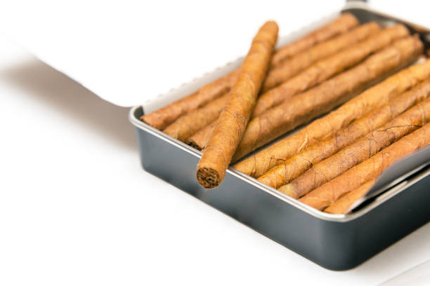 istock Box of cigarillos on a white background. On the box is one cigarillo 1158762010