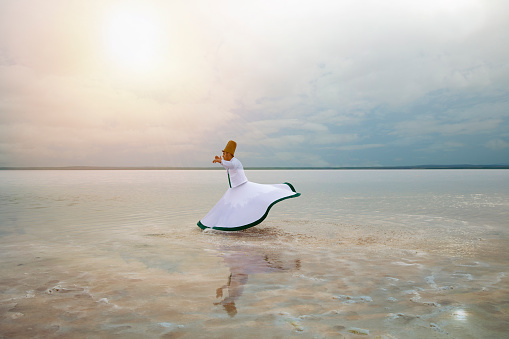 sunset and whirling at the sea, sufi. sufi whirling (Turkish: Semazen) is a form of Sama or physically active meditation which originated among Sufis.