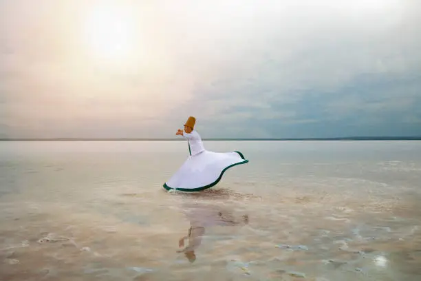 sunset and whirling at the sea, sufi. sufi whirling (Turkish: Semazen) is a form of Sama or physically active meditation which originated among Sufis.
