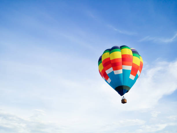 istock Hot air balloon in Flight with blue sky background with copyspace 1158762352