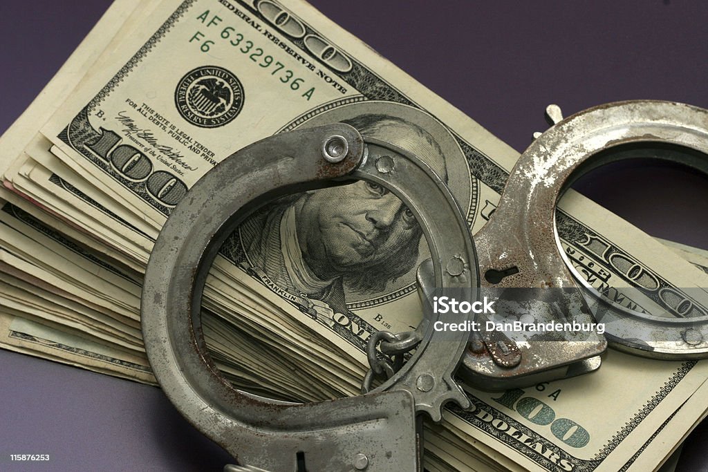 L'argent et des poignets - Photo de Chiffre 100 libre de droits
