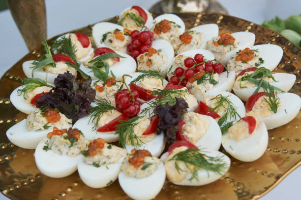 istock Stuffed eggs canapes with soft cheese chive and caviar 1158762602