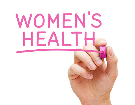 Salud de las mujeres escrita a mano con marcador rosa photo
