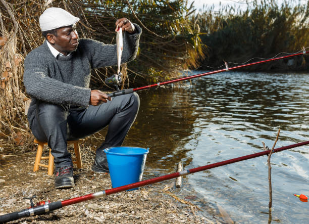 istock Friendly mature Afro fisherman 1158763464