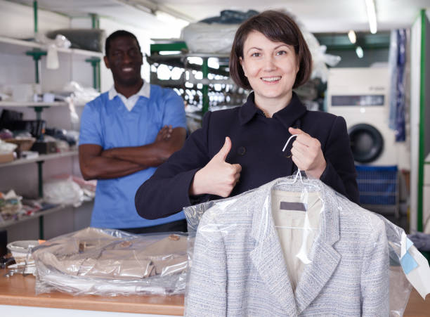 istock Satisfied female client with clean garment 1158763681