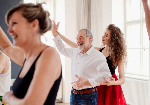 istock Group of senior people in dancing class with dance teacher. 1158763741