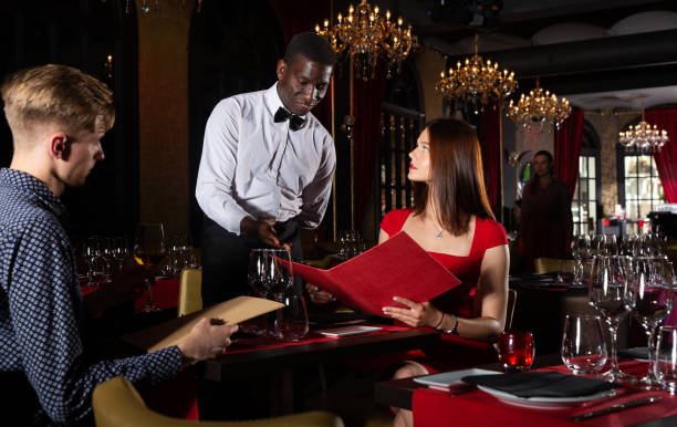 istock Man and woman with menu 1158769381