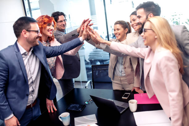 istock Business team showing unity,celebrating success 1158769638