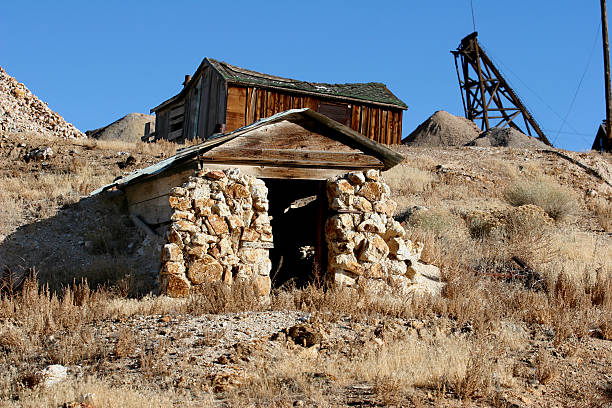Stone Miner's Shack Old stone miner's shack sits forgotten in the Nevada Desert. miners cabin stock pictures, royalty-free photos & images