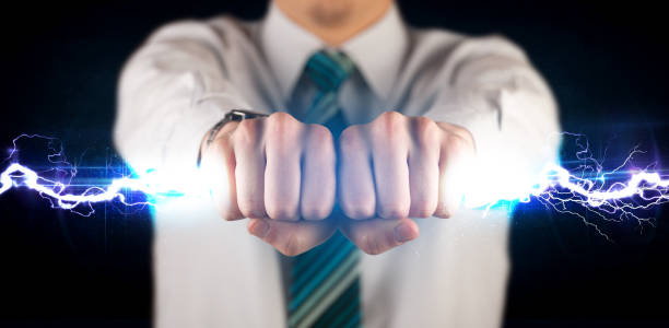 istock Business man holding electricity light bolt in his hands 1158773905