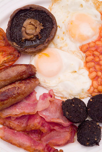 istock Eggs beans sausage and mushroom english breakfast 115877425