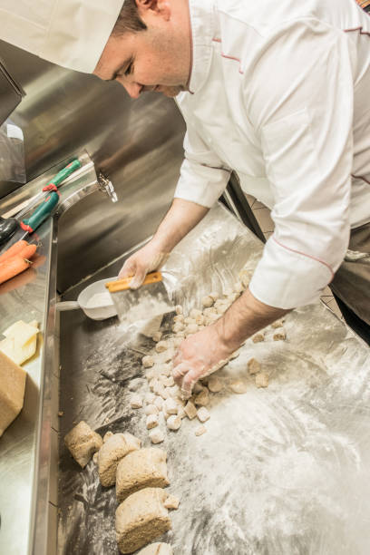 istock Chef in the Restaurant Making Delicious Fresh Polenta Gnocchi 1158776173