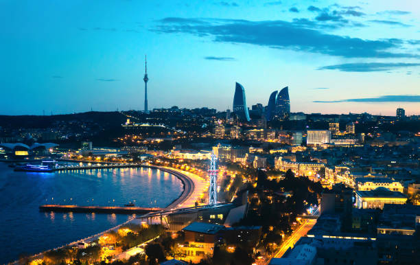 Baku at night. The capital city of Azerbaijan. Aerial panoramic cityscape view. Baku at night. The capital city of Azerbaijan. Aerial panoramic cityscape view. Flame Towers, sea boulevard and street lights in the background. baku photos stock pictures, royalty-free photos & images