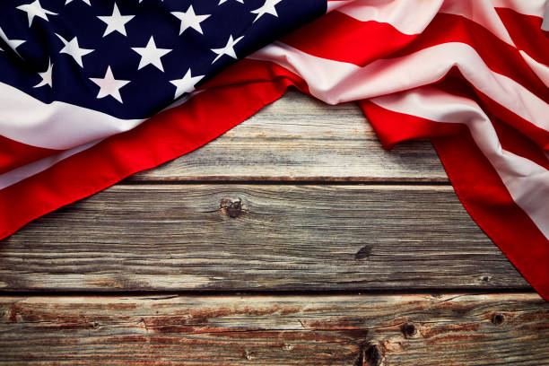istock American flag on old rustic wooden board. Concept Important Day American 1158780618