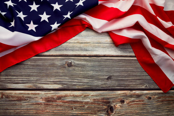 istock American flag on old rustic wooden board. Concept Important Day American 1158780619