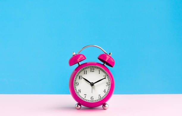 istock Close up colorful alarm clock on pastel background.timing concepts 1158781621