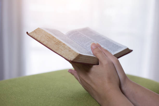 istock Women reading the Holy Bible,Reading a book. 1158781868