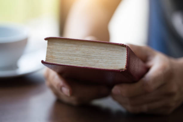istock Man reading from the holy bible, close up 1158781956