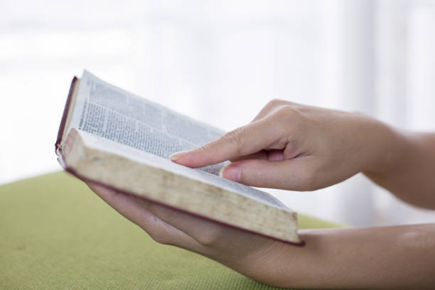 istock Women reading the Holy Bible,Reading a book. 1158781959