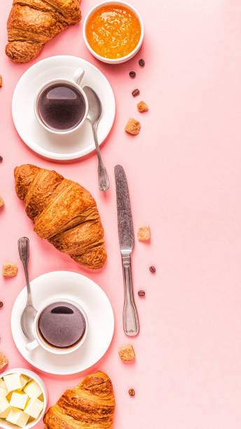 istock Coffee and croissants on pastel background 1158782066