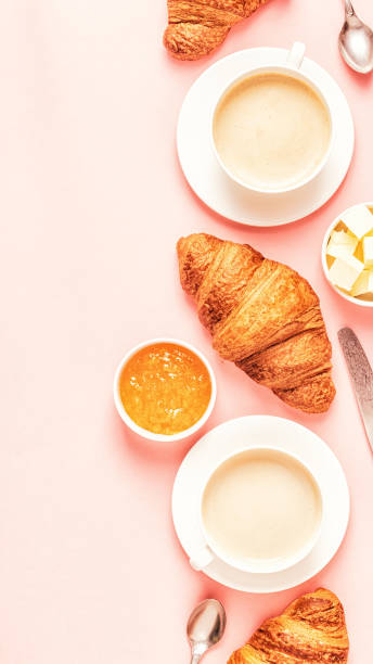 istock Coffee and croissants on pastel background 1158782109