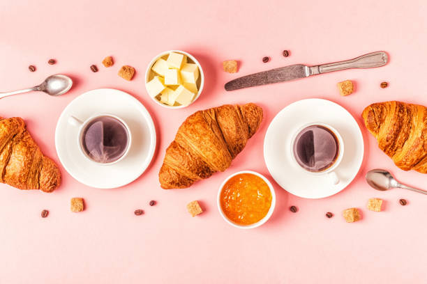istock Coffee and croissants on pastel background 1158782182