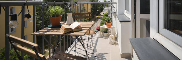 istock Balcony with wooden table 1158782220