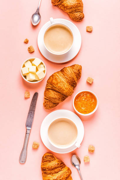 istock Coffee and croissants on pastel background 1158782331