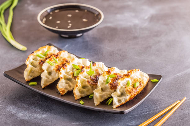 istock Gyoza or dumplings snack with soy sauce, selective focus 1158782885