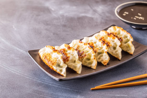 istock Gyoza or dumplings snack with soy sauce, selective focus 1158782896