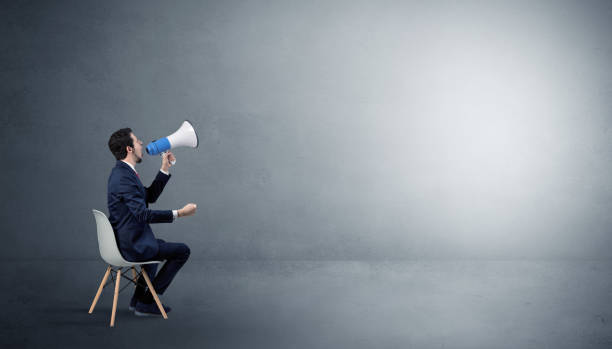 istock Businessman staying in an empty room with stuffs on his lap 1158783783
