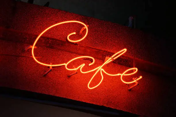 Night scene of cafe`s red neonsign