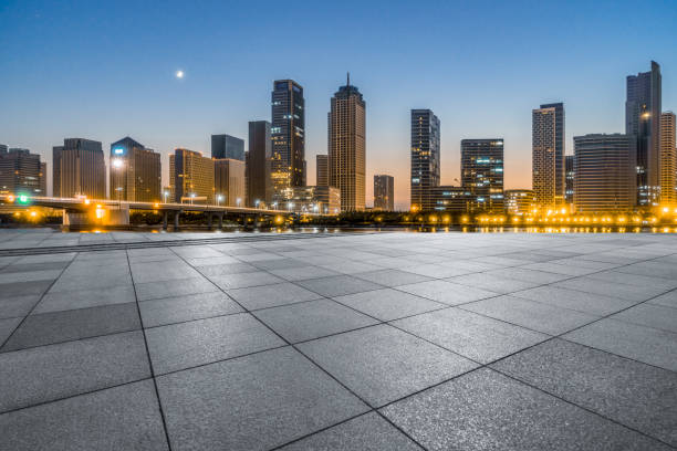 istock night view of empty brick floor front of modern building 1158784062
