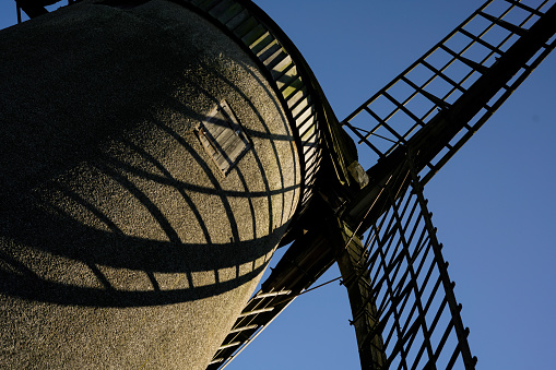 Looking up at an old windmill