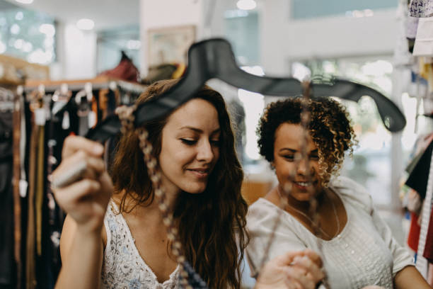 istock Young women vintage clothes shopping 1158785111